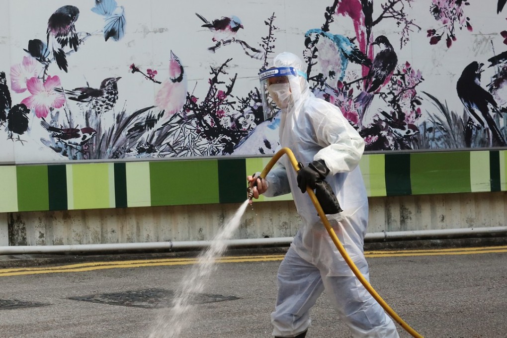 A worker cleansing the streets near the bird garden and market in Mong Kok. Photo: Felix Wong