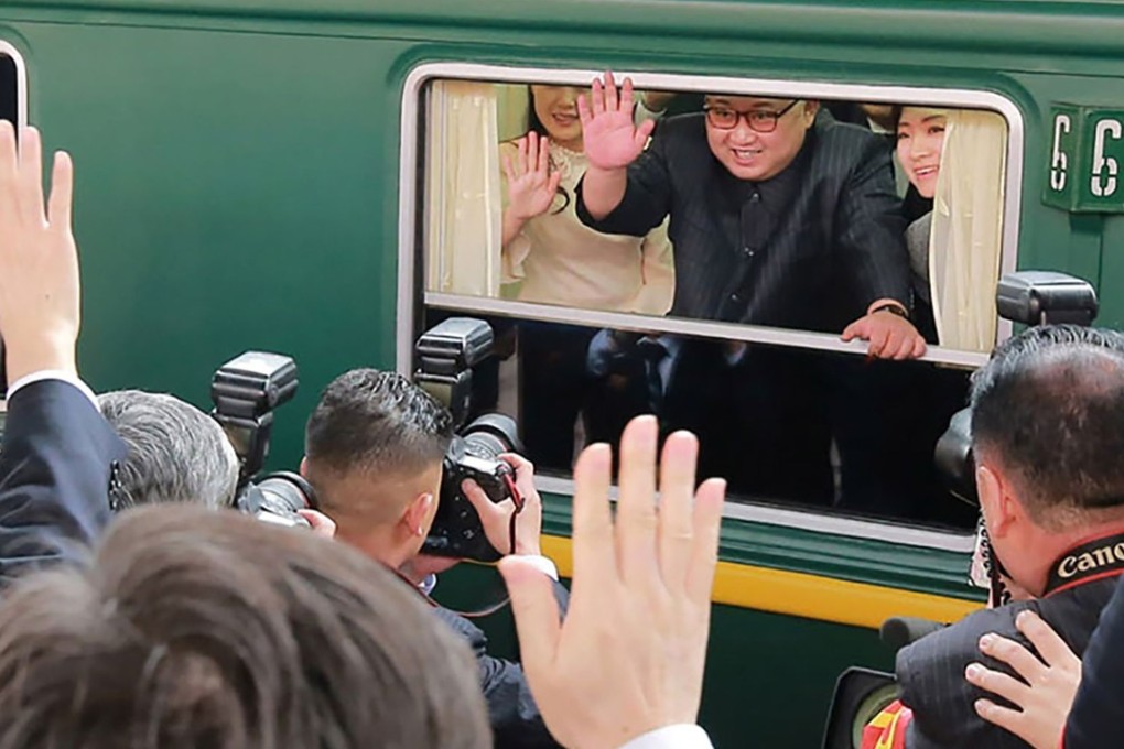 Kim Jong-un waves as his train leaves Beijing following his visit to China at the end of March. Photo: AFP/ KCNA via KNS