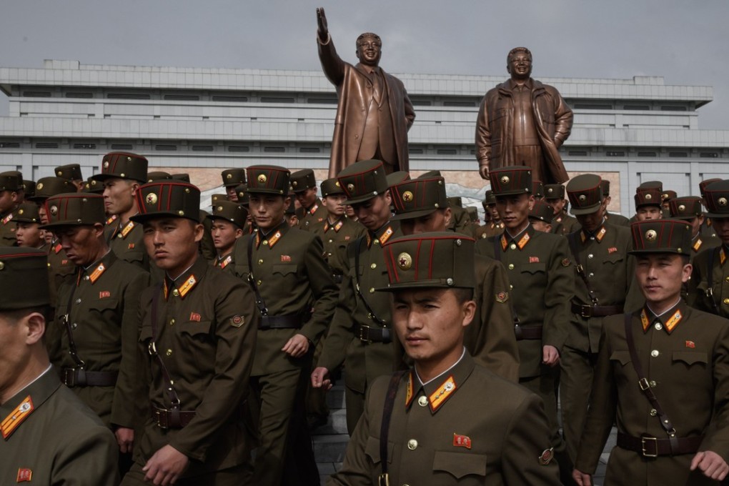 North Korean soldiers after paying their respects before the statues of late North Korean leaders Kim Il-sung and Kim Jong-il in Pyongyang. Photo: AFP