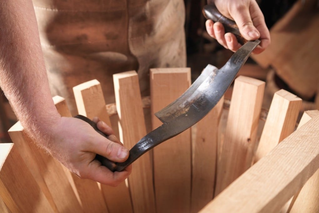 Cooper with barrel-making tools. Pictures: Alamy