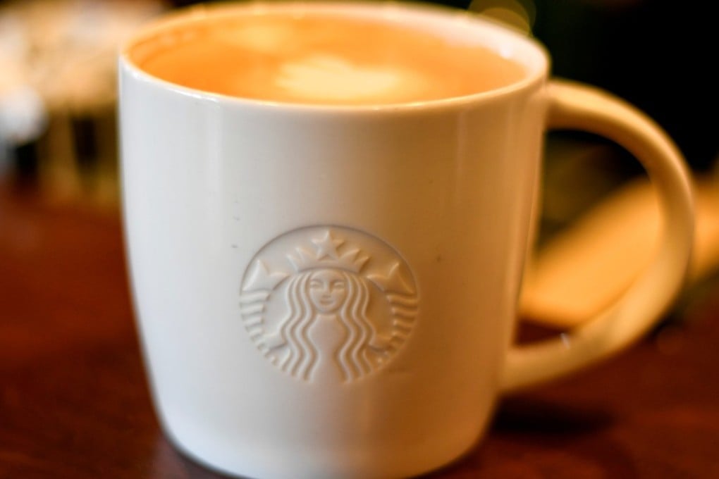FILE PHOTO: A cup of coffee rests on a counter at a Starbucks coffeehouse in Austin, Texas, US, February 10, 2017. REUTERS/Mohammad Khursheed/File Photo
