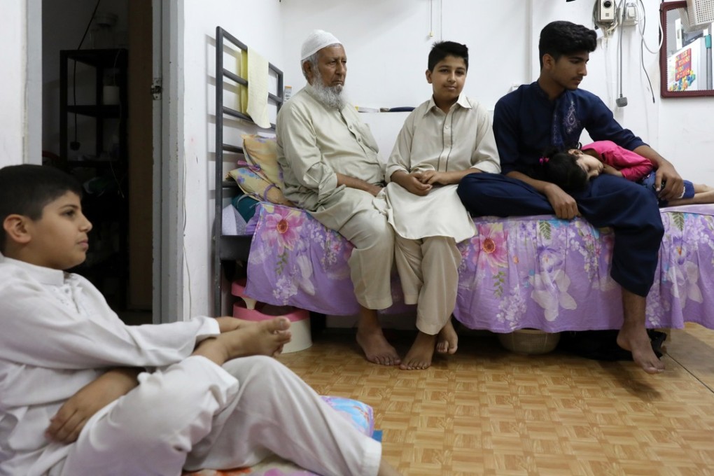 From left: Haseeb, Fazal, Ayaz, Ibrar and Sana have been waiting for public housing since 2012. They have been living in a cubicle home since 2010 because of the long wait and difficulties finding a better place. Photo: Sam Tsang