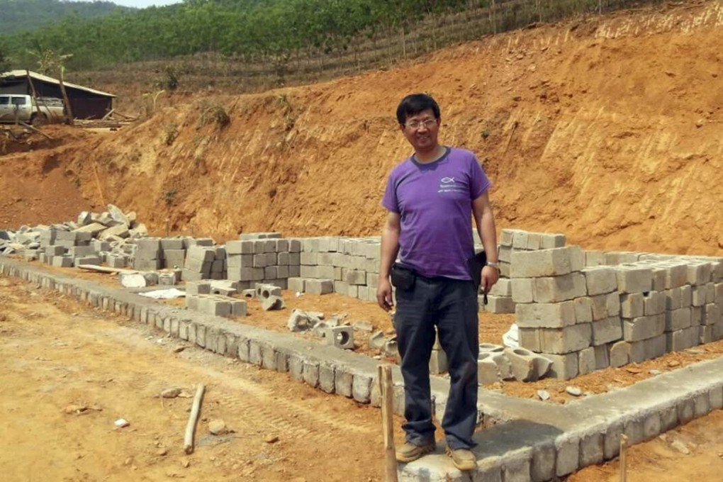 Reverend John Sanqiang Cao breaks ground on a school in Wa State, Myanmar. Photo: AP