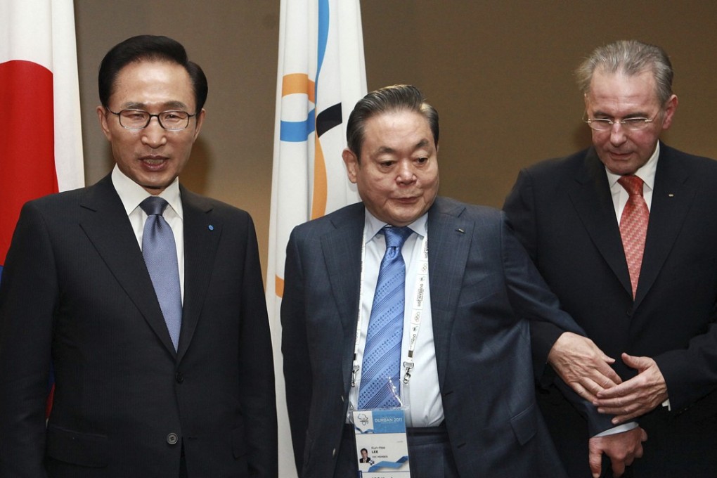 Former International Olympic Committee (IOC) president Jacques Rogge (right) meets with former South Korean President Lee Myung-bak and Samsung Chairman Lee Kun-hee (centre) in 2011 in Durban, South Africa, ahead the opening ceremony for the 123rd IOC session to decide the host city for the 2018 Olympics Winter Games. Samsung has denied a media report it launched illicit lobbying to help bring the 2018 Winter Olympics to Pyeongchang, South Korea. Photo: AP