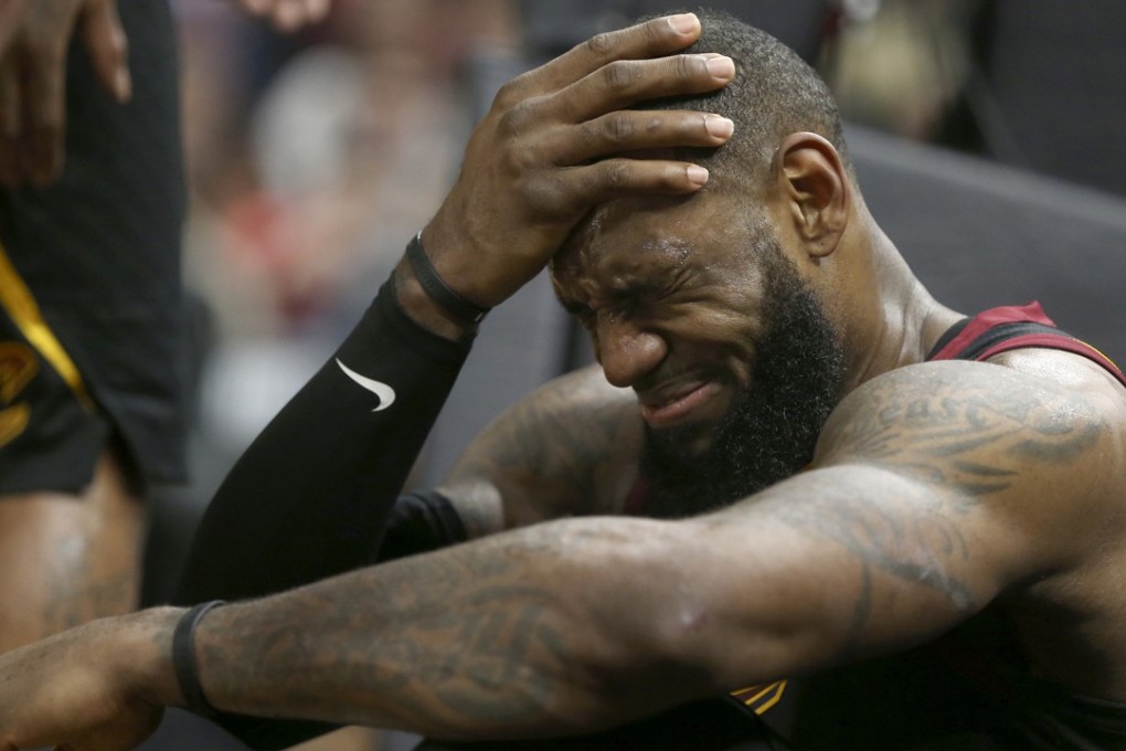 Cleveland Cavaliers’ LeBron James winces after a third quarter foul by Indiana Pacers’ Lance Stephenson. Photo: TNS