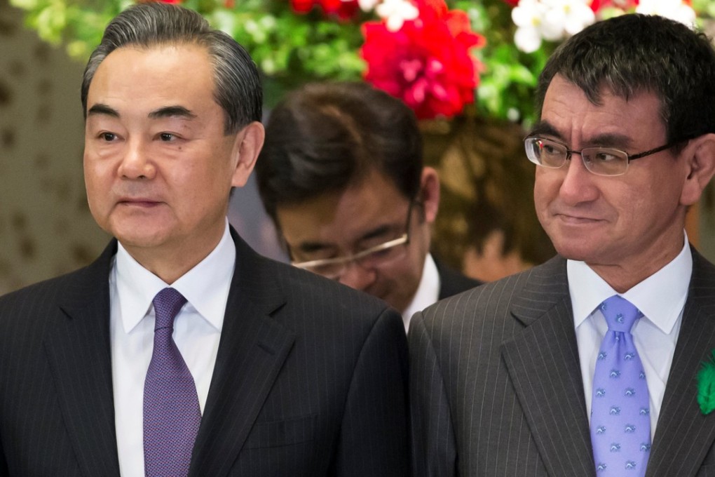 Chinese Foreign Minister Wang Yi and his Japanese counterpart Taro Kono meet for a high-level Japan-China economic dialogue in Tokyo, Japan, on Monday. Photo: Reuters