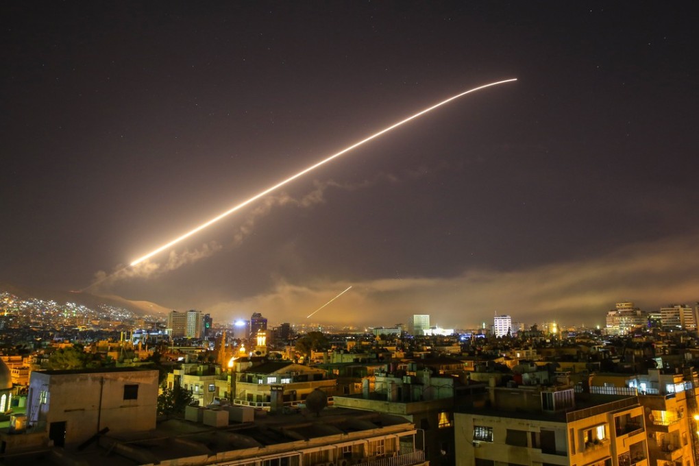 Missile fire lights up the Damascus sky on April 14 as US President Donald Trump announced air strikes against Syria in retaliation for the country's alleged use of chemical weapons. The possibility of a confrontation between the US and Russia, Syria’s ally, is threatening economic confidence globally. Photo: AP