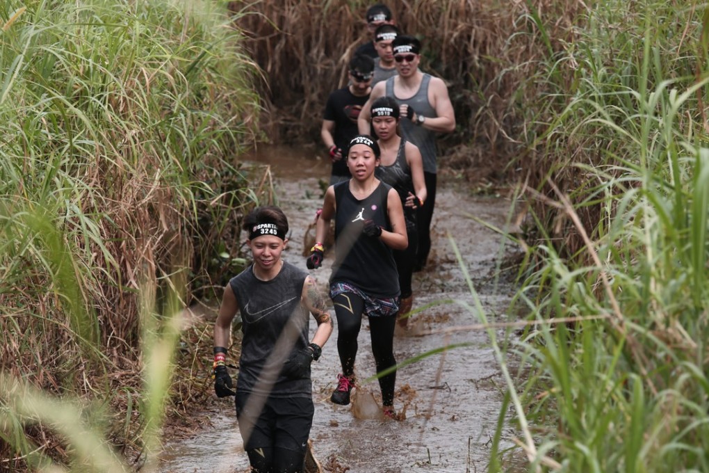 The Spartan Race starts with a run through mud. To our horror, we found out this did no count as one of the 20 obstacles. Photos: Jonathan Wong