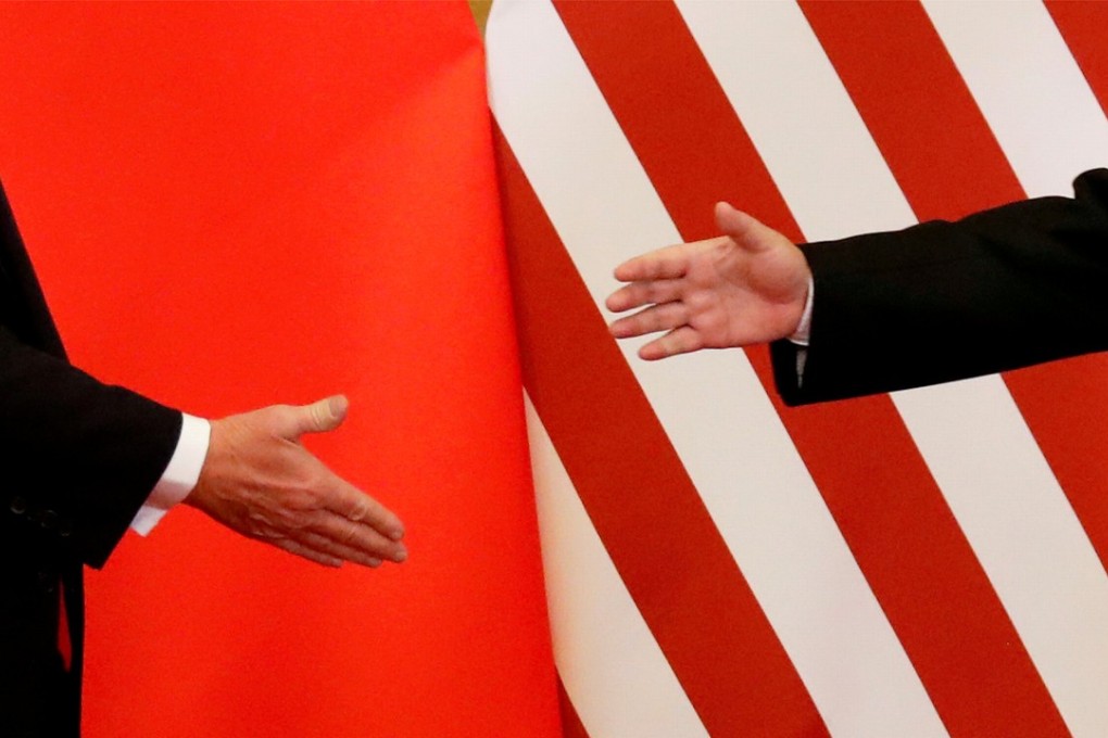 US President Donald Trump (left) and Chinese President Xi Jinping shake hands after making joint statements at the Great Hall of the People in Beijing last November. China is challenging the established global order of governance built on the Bretton Woods institutions and led by the US. Photo: Reuters