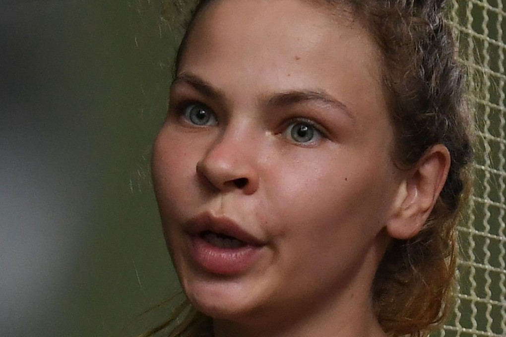 Detained Belarusian model Anastasia Vashukevich, known by her pen name Nastya Rybka, arrives at a holding cell to face trial at a court in Pattaya on April 17. Photo: AFP