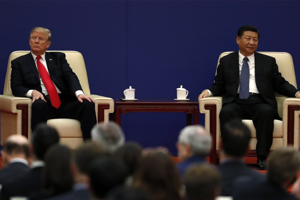 US President Donald Trump (left) sits next to Chinese President Xi Jinping during a business event at the Great Hall of the People in Beijing in November 2017. Ties between the two countries have been strained since the start of the year. Photo: AP