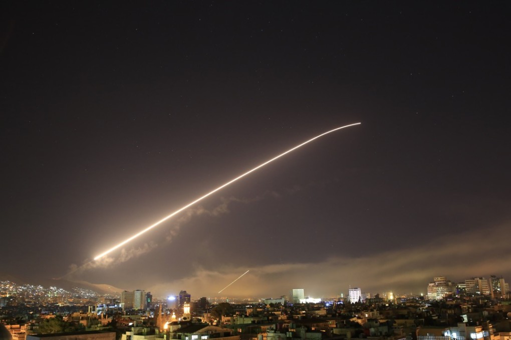 The Damascus sky lights up with missile fire early Saturday as the US launches an attack on Syria targeting different parts of the capital. Photo: AP