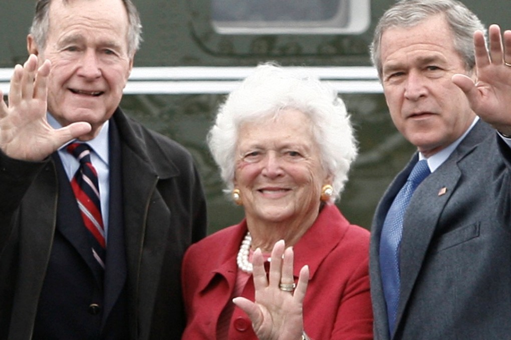 Former first lady Barbara Bush stands between her lifelong husband George H.W. Bush and son George W. Bush. Mrs Bush died on Tuesday, aged 92. Photo: Reuters
