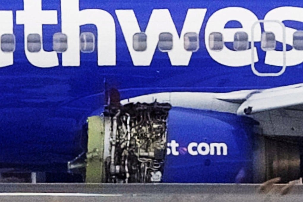 Emergency personnel monitor the damaged engine of Southwest Airlines Flight 1380, which was diverted to the Philadelphia International Airport on April 17, 2018 after the airline crew reported damage to one of the aircraft's engines. Photo: Reuters