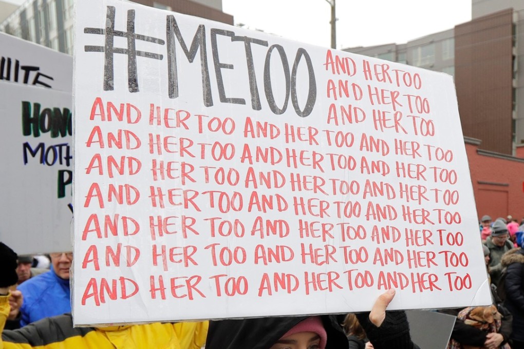 A marcher carries a sign with the popular Twitter hashtag #MeToo used by people speaking out against sexual harassment as she takes part in a Women's March in Seattle in January. Photo: AP