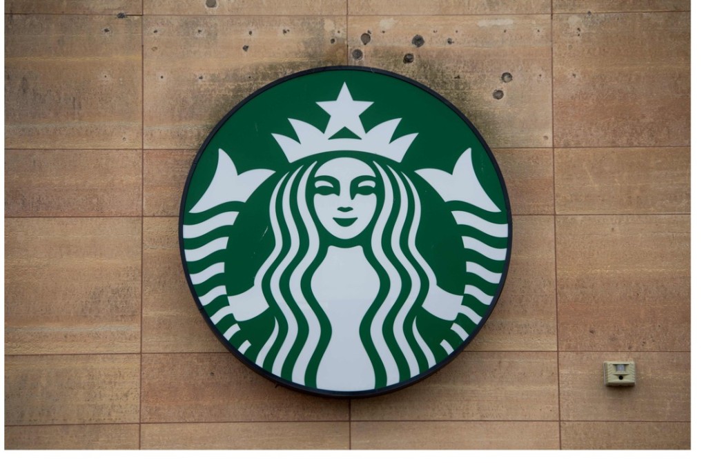 The sign for a Starbucks Coffee shop is seen in Washington, DC, on Tuesday, following the company's announcement that it will close more than 8,000 US stores on May 29 to conduct racial-bias education. Photo: AFP