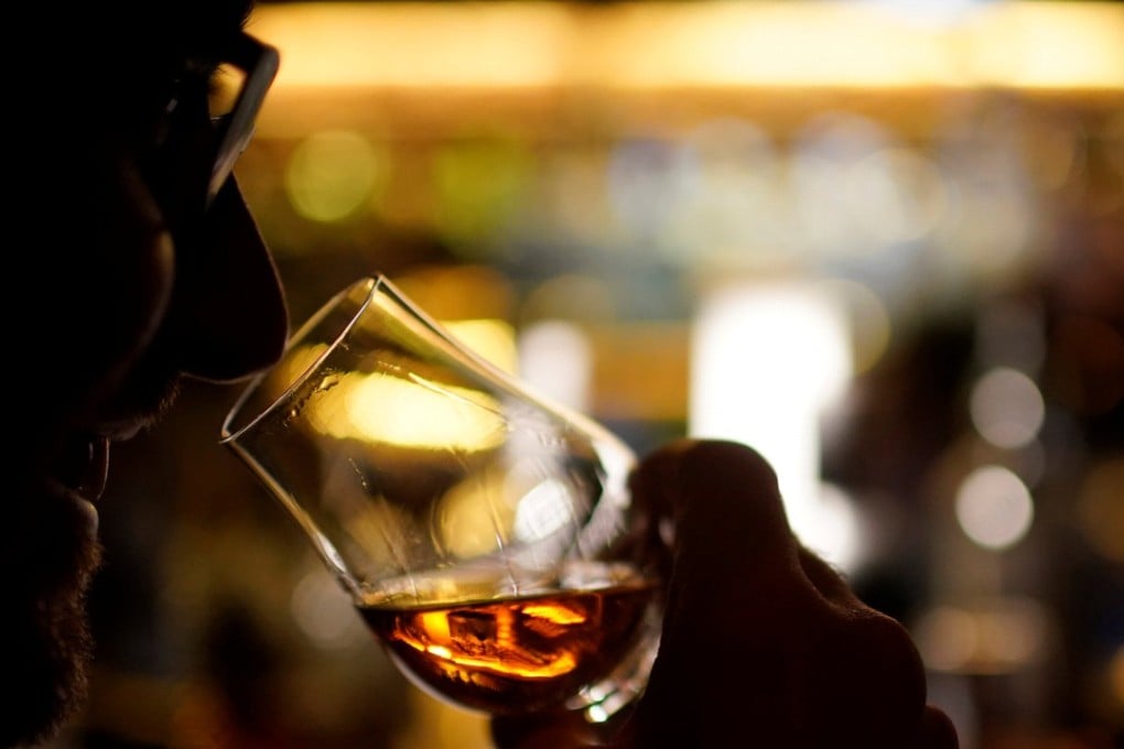A customer drinks American whiskey at a bar in Shanghai. Photo: Reuters