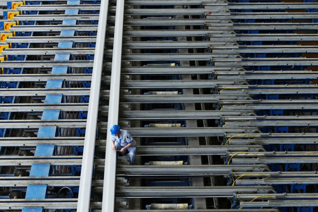A worker in eastern China checks aluminium products to be used for train carriages. The US says it imported about US$600 million of common alloy aluminium sheet from China in 2016. Photo: Reuters