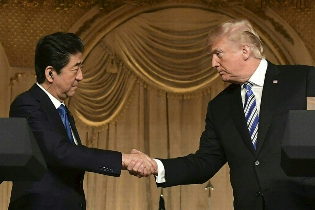 US President Donald Trump and Japanese Prime Minister Shinzo Abe shake hands at a joint press conference at Trump's Mar-a-Lago estate in Palm Beach, Florida, on Wednesday. Photo: AFP
