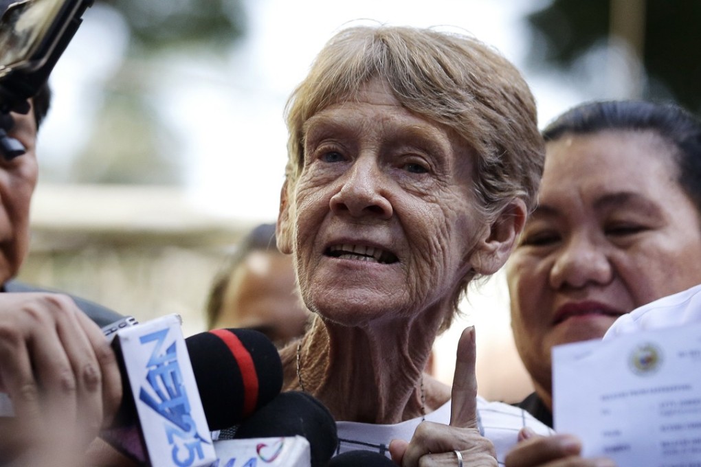 Sister Patricia Fox speaking with reporters after she was released from custody in Manila on Wednesday. Photo: AP
