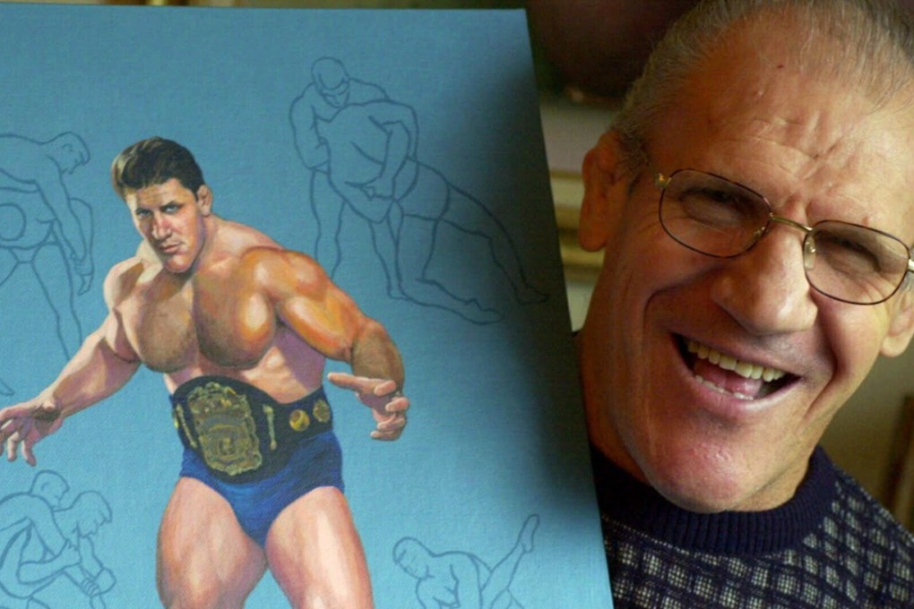 In this November 30, 2000 file photo, former pro wrestler Bruno Sammartino, aged 65, poses with a painting of him in his prime weighing 275 pounds in 1965 at age 35, in his Pittsburgh home. Bruno Sammartino, professional wrestling's ‘Living Legend’ and one of its longest-reigning champions, has died. Sammartino was 82. Photo: AP