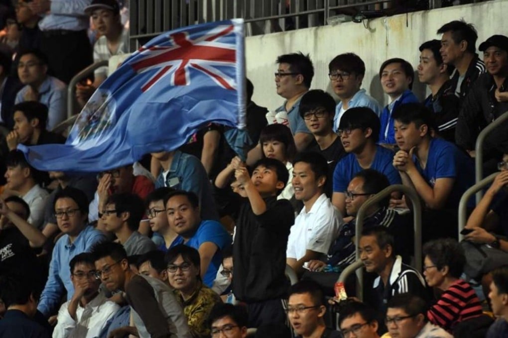 An Eastern fan waves the old British colonial flag of Hong Kong during an AFC Champions League match, at Mong Kok Stadium in February 2017. Photo: AFP