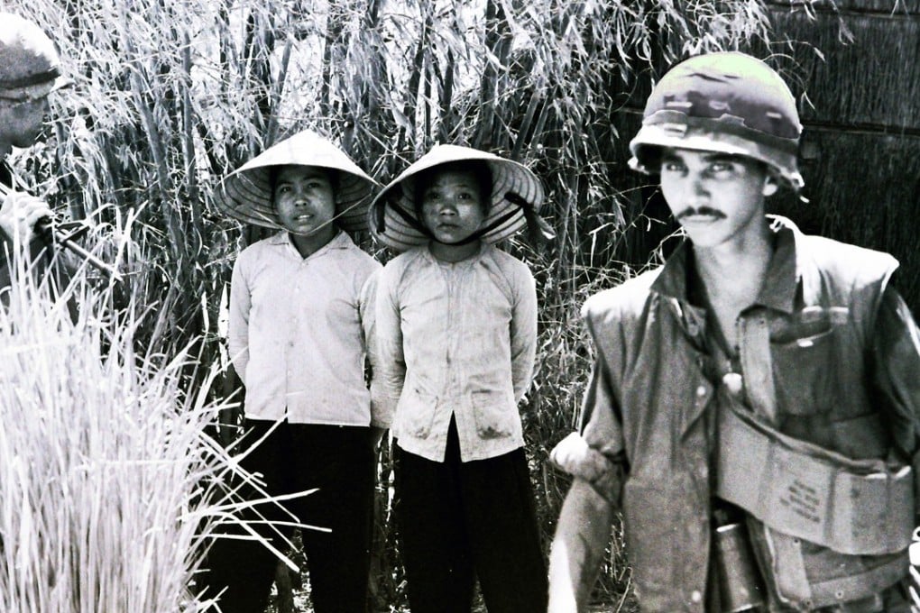 Viet Cong prisoners and American soldiers in Vietnam. Photo: Derek Maitland
