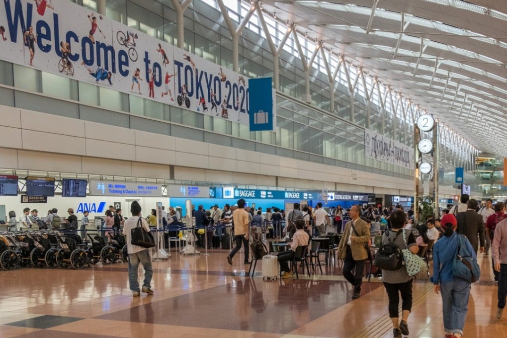 Travellers at the departure hall of Terminal 2, Haneda International Airport in Tokyo, Japan.