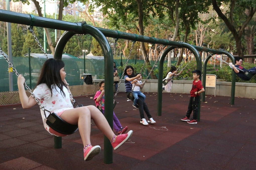 Swings offer some fun at a playground in Victoria Park in Causeway Bay. Photo: Edmond So