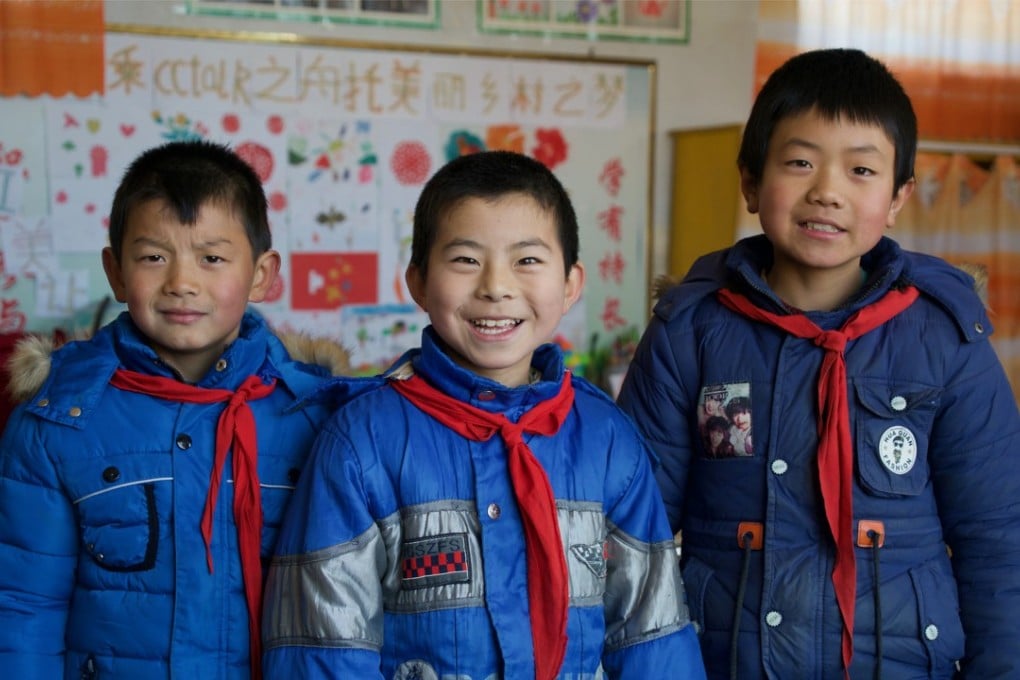 Du Yongsheng, Chang Wenxuan and Shi Zhengang, all aged 10, are the only remaining pupils at the primary school in Lumacha village, in China’s northwestern Gansu province. Photo: Tom Wang
