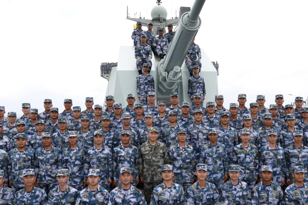 Chinese President Xi Jinping, in green, joins the PLA Navy fleet in the South China Sea. Photo: AP