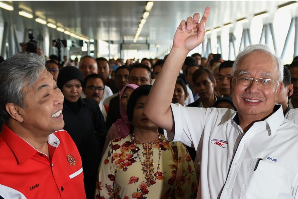 Malaysian Prime Minister Najib Razak, right, and Deputy Prime Minister Ahmad Zahid Hamidi at the launch of the Sungai Buloh-Kajang MRT line, in Kuala Lumpur last July 17. Photo: AFP