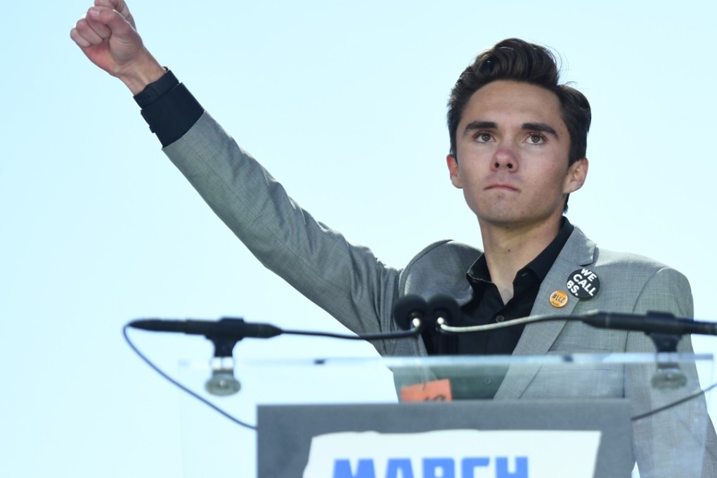 David Hogg, a Marjory Stoneman Douglas High School student, speaks to the crowd at the ‘March For Our Lives’ rally against gun violence on March 24 in Washington. Hogg and his sister Lauren are writing a book about the massacre, publisher Penguin Random House has announced. Photo: AFP