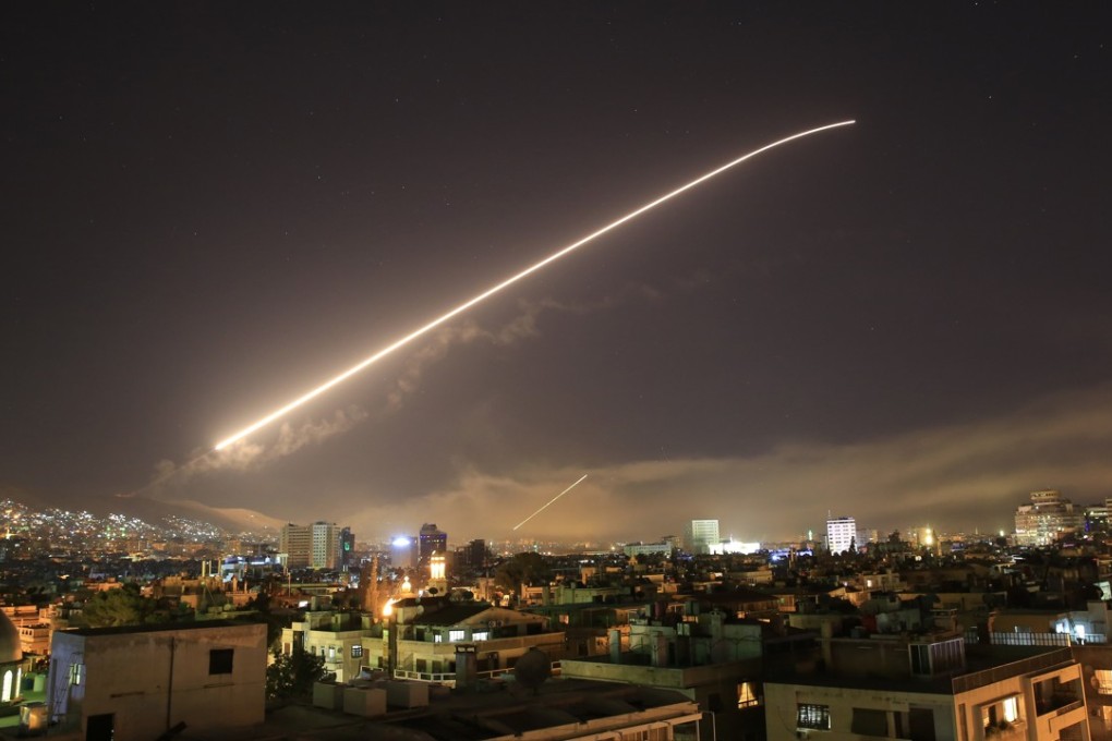 The Damascus sky lights up from missile fire as the US launches an attack on Syria targeting different parts of the capitalon Saturday. Photo: AP