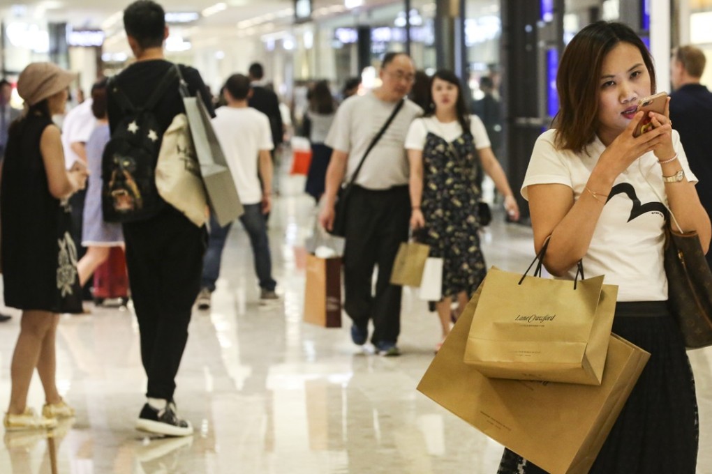The number of consumers shopping at physical stores at least once a week started to increase since 2015, according to PwC. Photo: Edward Wong
