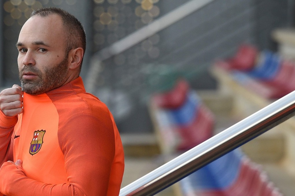 Barcelona midfielder Andres Iniesta arrives for a training session at the Joan Gamper Sports Centre on the eve of the Uefa Champions League match against Chelsea. Photos: AFP