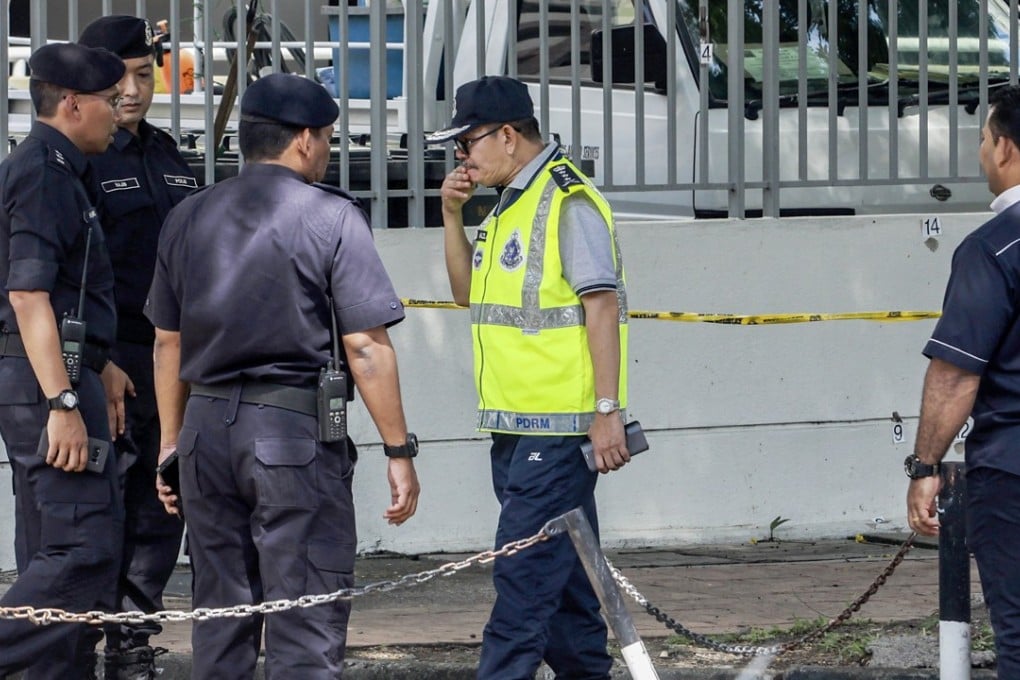 Malaysian Police collect evidence at the crime scene where a Palestinian scientist Fadi Mohammad al-Batsh was reportedly assassinated in a drive-by motorcycle shooting in Kuala Lumpur. Photo: EPA