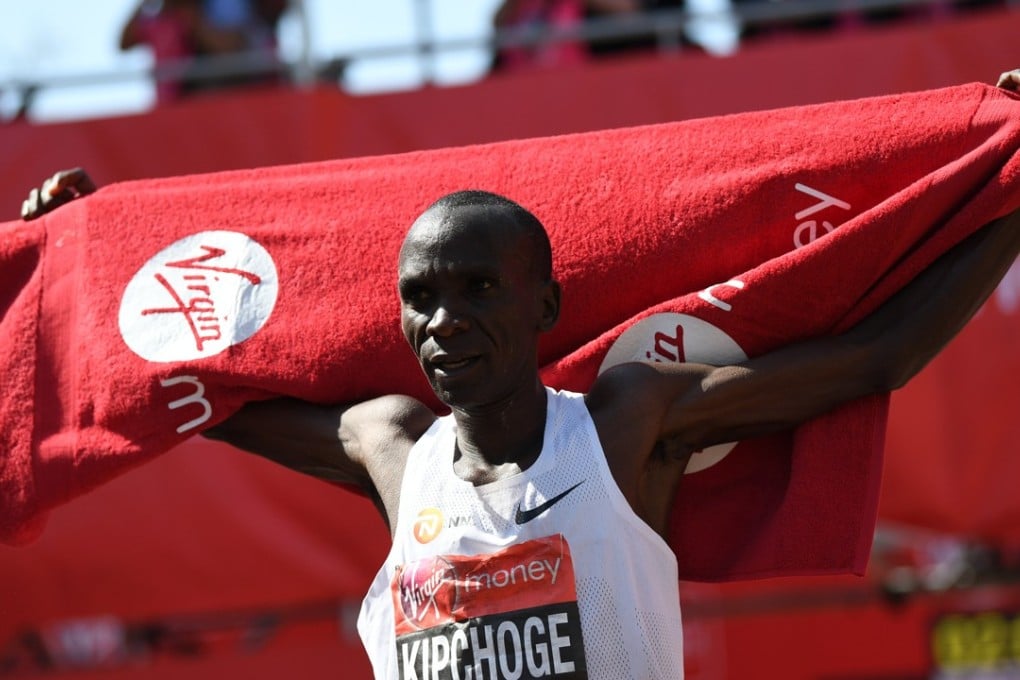 Kenya's Eliud Kipchoge celebrates after winning the men's race at the 2018 London Marathon. Photos: EPA
