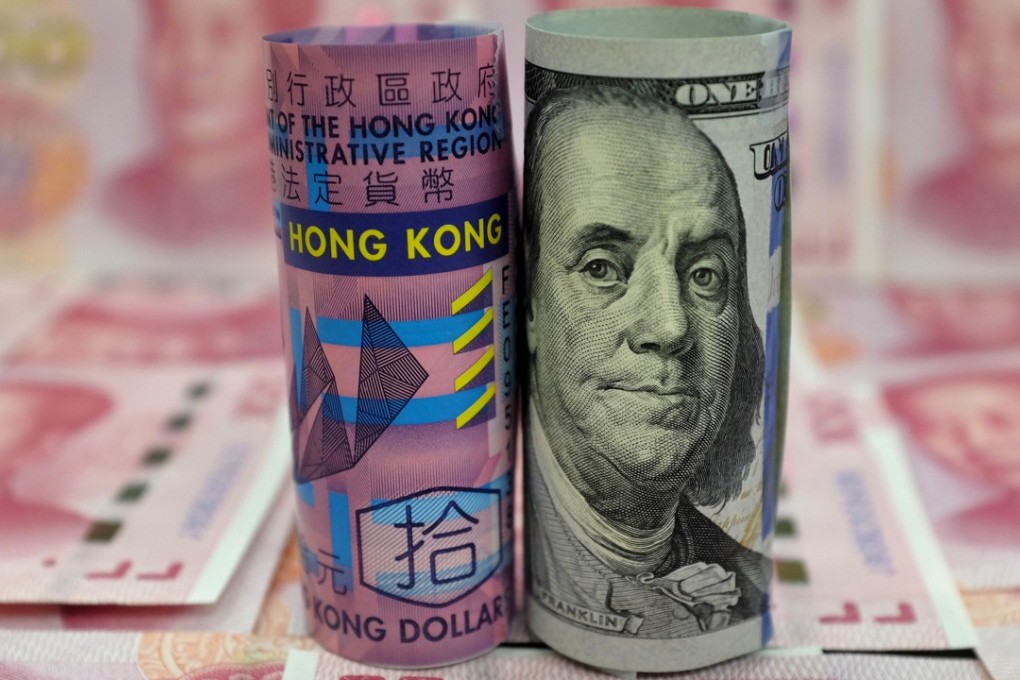 A Hong Kong 10 dollar banknote, a US 100 dollar banknote, and Chinese 100 yuan banknotes are seen in this picture illustration. Photo illustration: Reuters