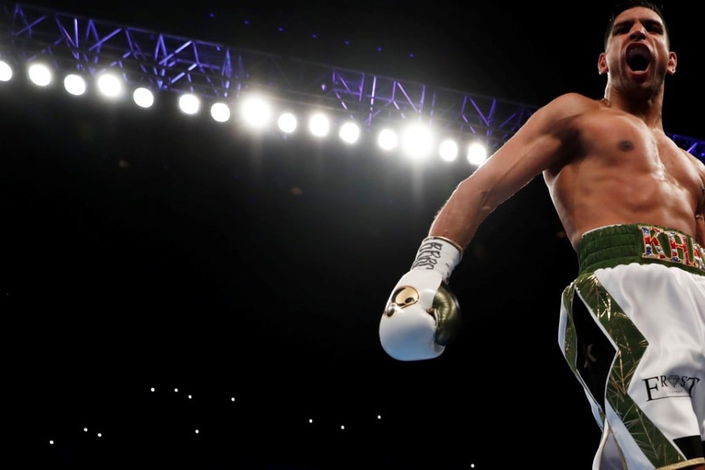 Amir Khan celebrates beating Phil Lo Greco in Liverpool. Photo: Reuters