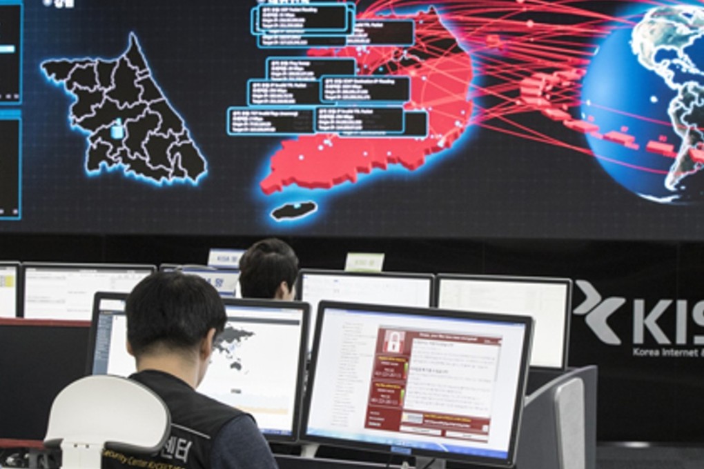Employees watch electronic boards monitoring possible ransomware cyberattacks at the Korea Internet and Security Agency in Seoul, South Korea. Photo: Yonhap
