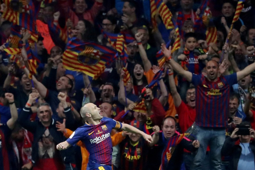 Andres Iniesta celebrates scoring Barcelona’s fourth goal against Sevilla. Photos: Reuters