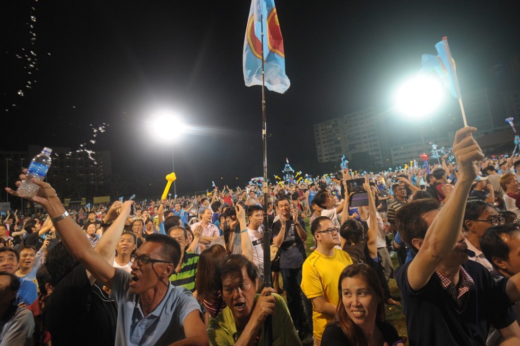 Workers Party supporters celebrate at Hougang stadium in Singapore after a general election in 2015. Photo: AFP