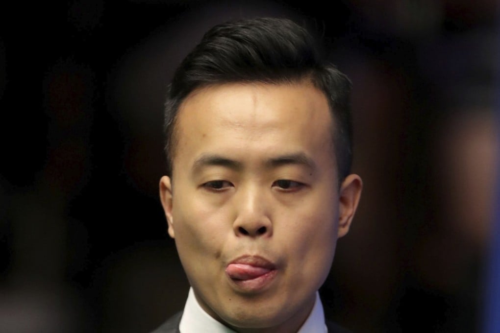 Hong Kong's Marco Fu assesses a shot against China’s Lyu Haotian at the Crucible. Photo: AP