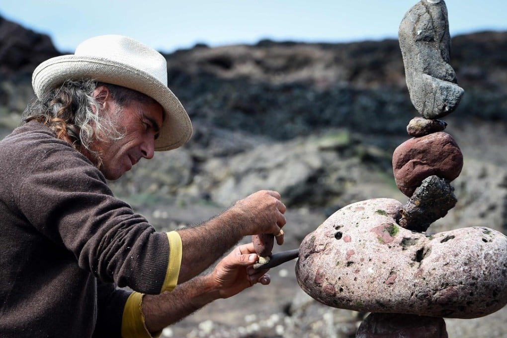 Marco Montesini from Spain competes in the European Stone Stacking Championships 2018 in Dunbar, Scotland, on Sunday. Agence France-Presse