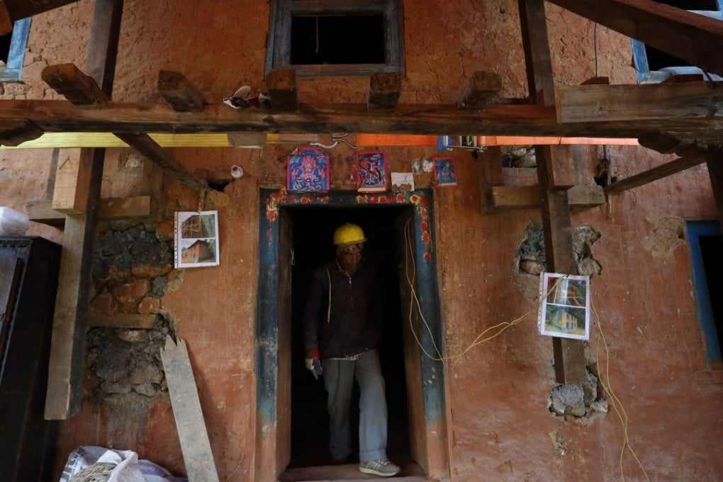 An earthquake-damaged house secured for retrofitting in the village of Dungkharka in Kavre district, some 45km east of Kathmandu. Photo: AFP