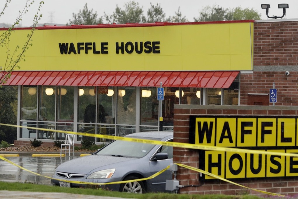 Police tape blocks off a Waffle House restaurant in Nashville after a gunman opened fire on Sunday. Photo: AP
