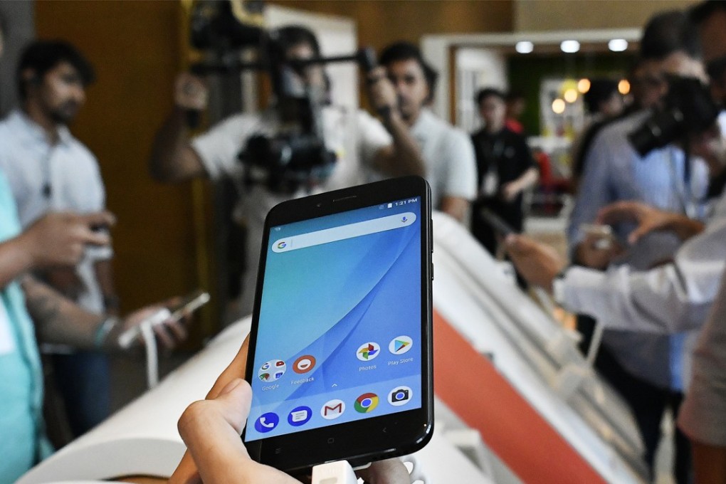 An attendee holds a Xiaomi Corp. Mi A1 dual camera device during the smartphone's launch in New Delhi, India, on Tuesday, Sept. 5, 2017. Google is teaming with China's Xiaomi to resurrect its Android One smartphone program for India, revamping a stalled effort to showcase its mobile software for users in emerging markets. Photographer: Anindito Mukherjee/Bloomberg
