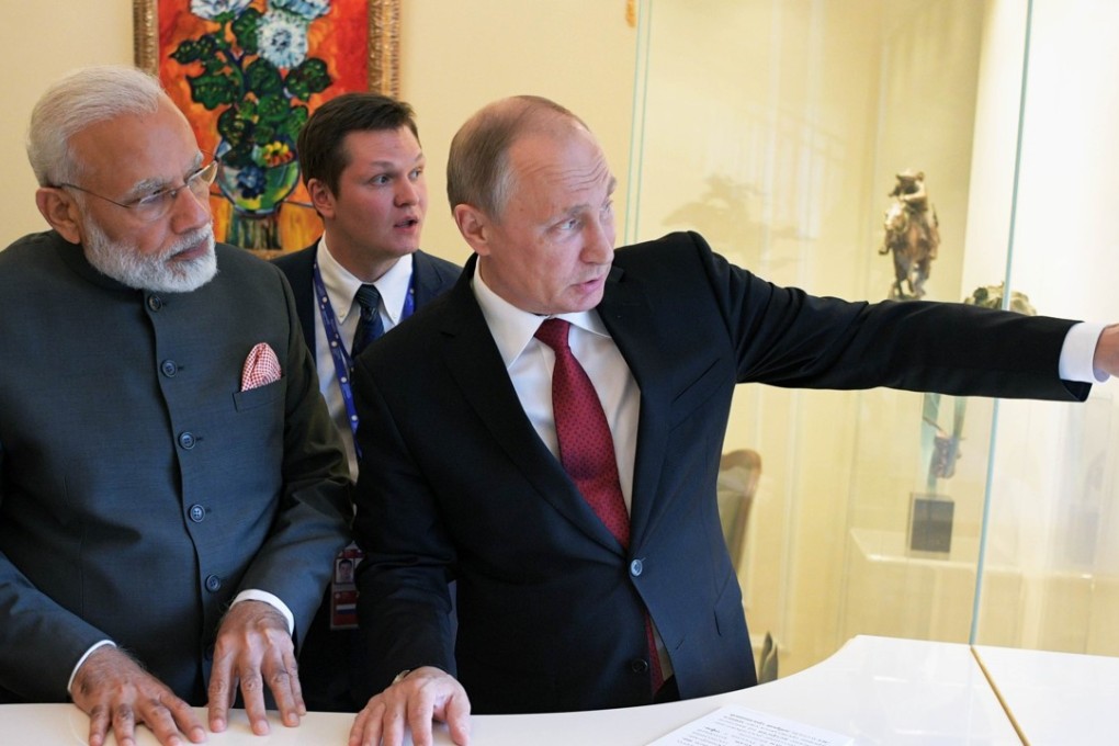 Russian President Vladimir Putin speaks with Indian Prime Minister Narendra Modi in St Petersburg. US sanctions on Russian military exports have put the brakes on a US$6 billion deal with India. Photo: Reuters