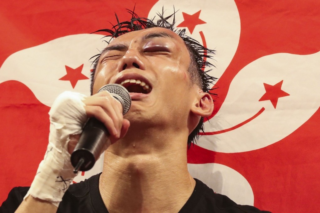 Hong Kong’s Rex Tso Sing-yu celebrates beating Kohei Kono in ‘Clash of Champions 3’ after suffering a grotesque eye injury. Photo: Edward Wong